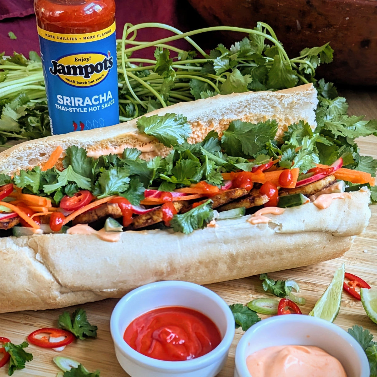 Jampot's Thai sriracha on a banh mi, with fresh coriander and lime.