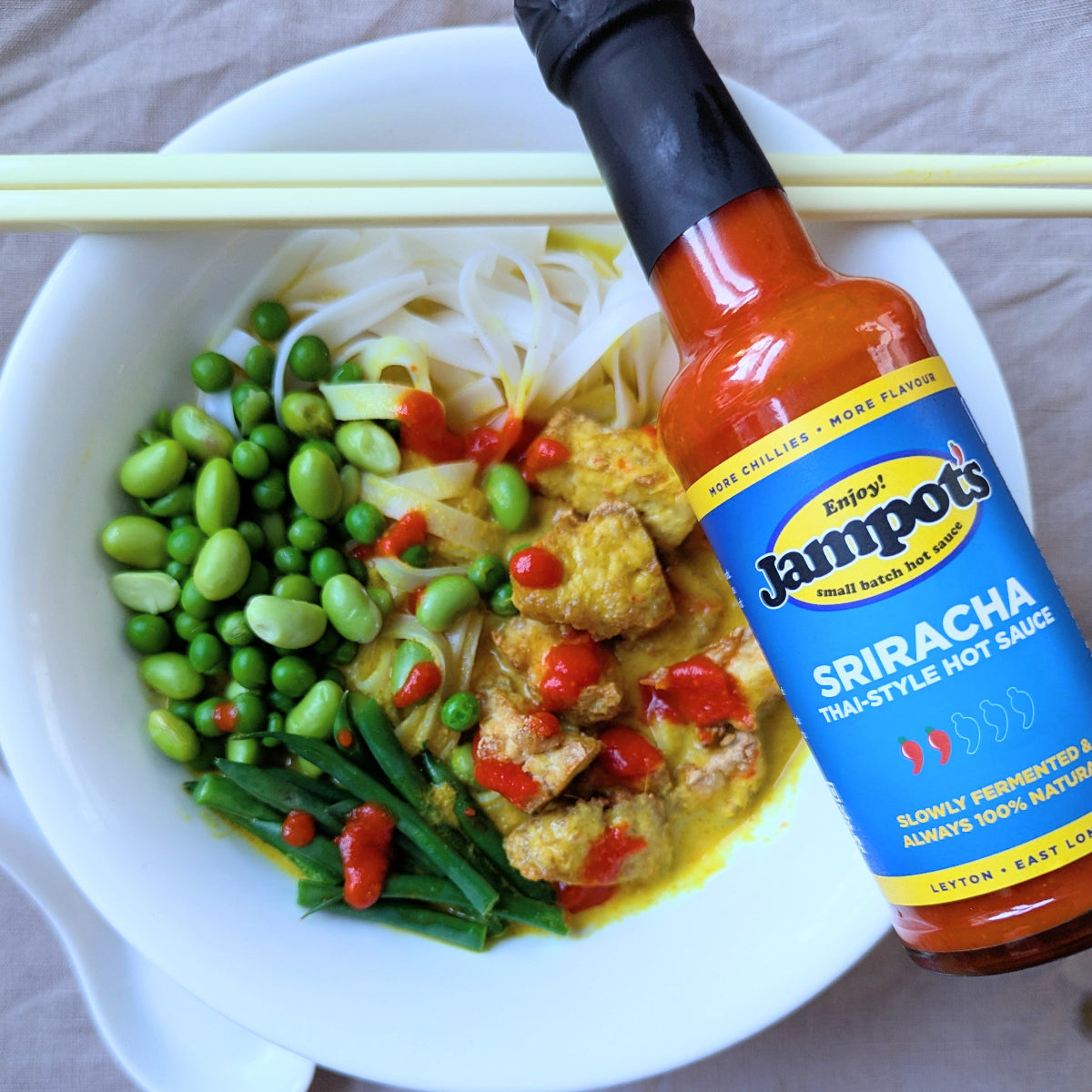 Jampot's sriracha poured over Thai yellow curry.