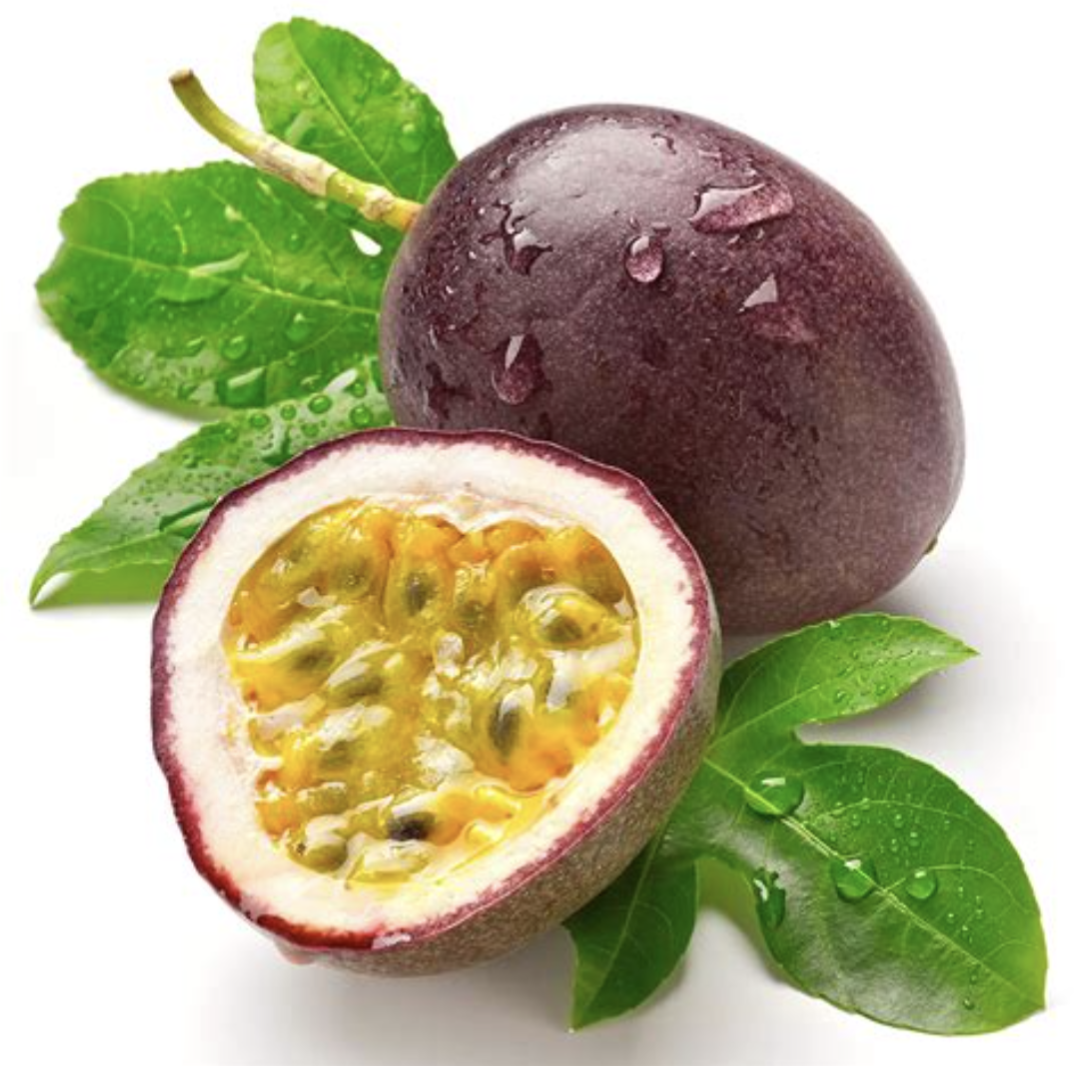 Passion fruit with a cut half showing seeds, surrounded by green leaves on a white background