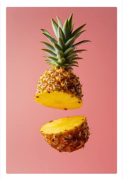 Half-cut pineapple on a pink background
