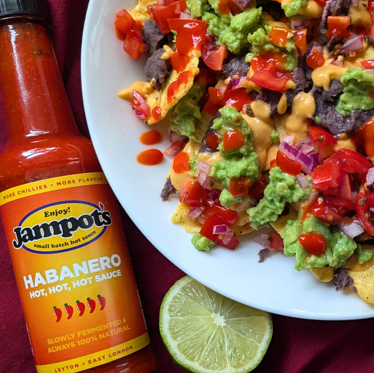 small -batch habanero hot sauce drizzled  over nachos
