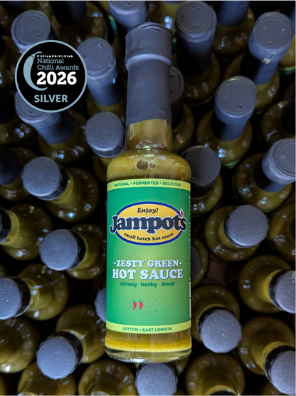 Jampot's zesty green hot sauce bottle with a 2026 Silver National Award badge on a background of similar bottles.