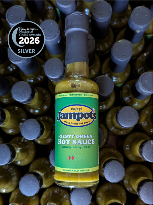 Jampot's zesty green hot sauce bottle with a 2026 Silver National Award badge on a background of similar bottles.